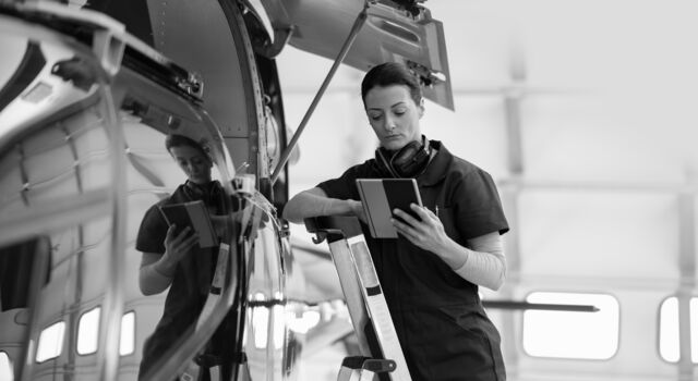 SINGLE-IMAGE_female-engineer-with-tablet-checking-airplane_oct23
