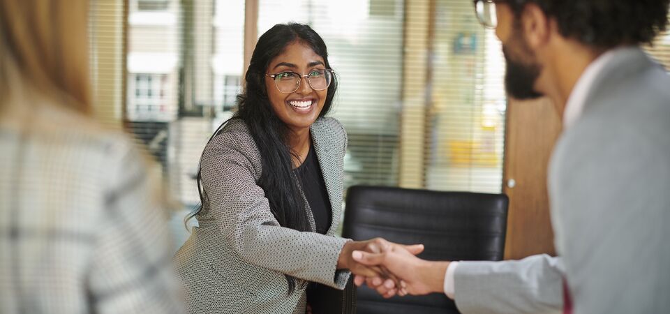 COLOUR-IMAGE_woman-shaking-hands_feb26